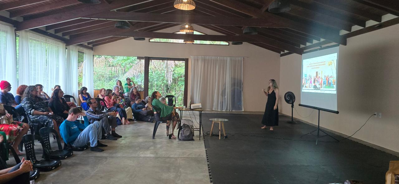 Workshop in the main hall with a screen and forest views