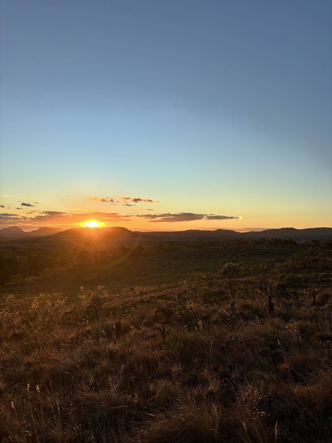 The vast Cerrado landscape with dramatic clouds, quartz country