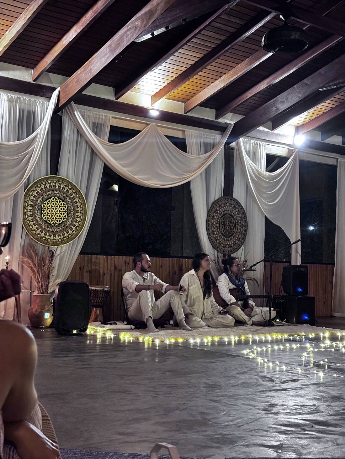 Evening ceremony in the shala with candlelight and live music