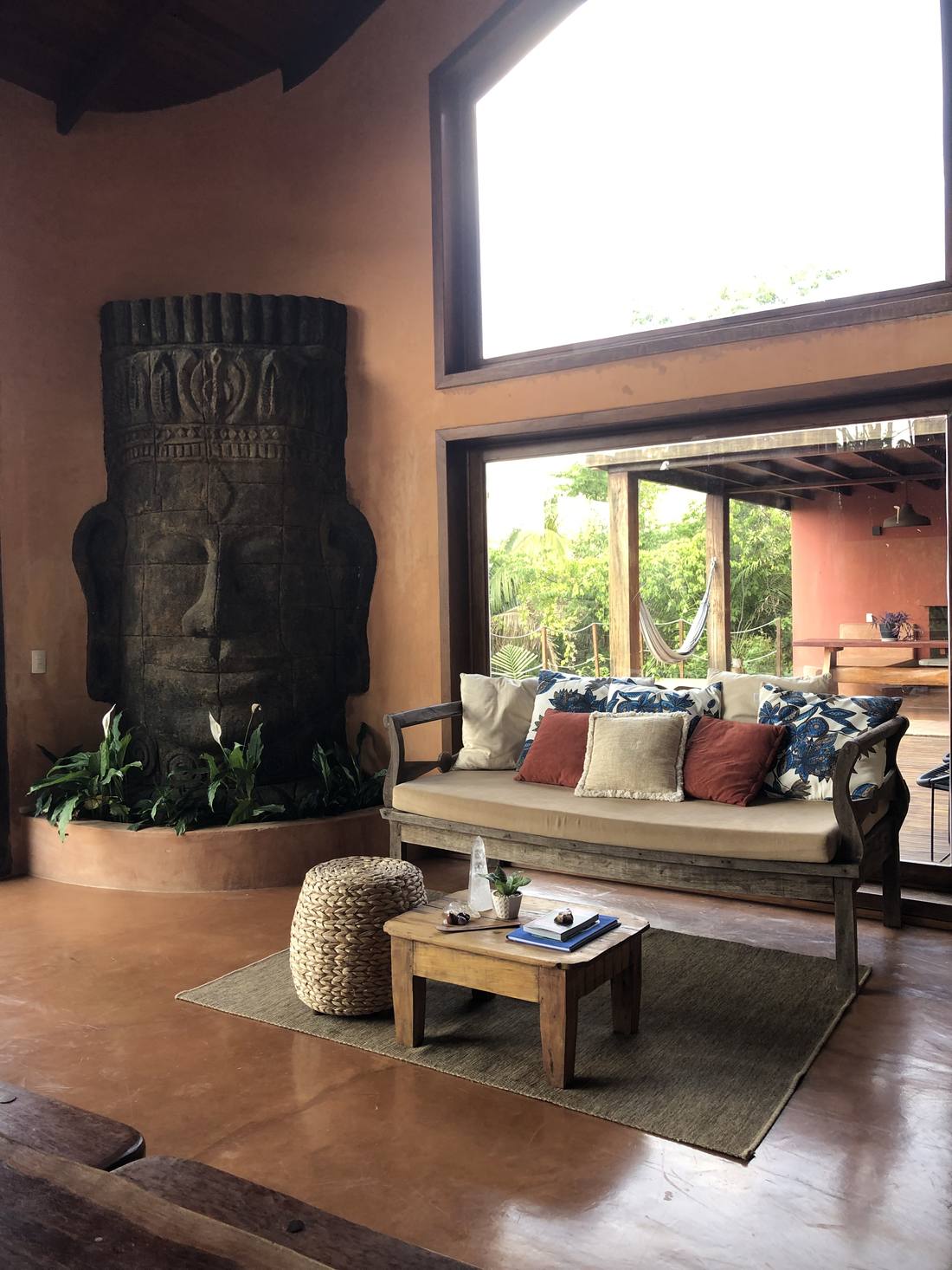 Living room with a monumental Buddha sculpture